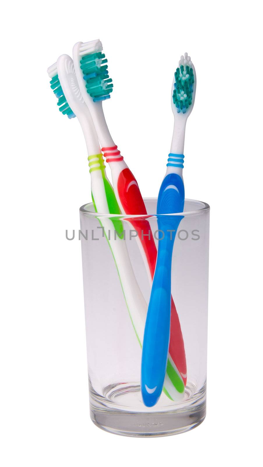toothbrushes in a glass on background.