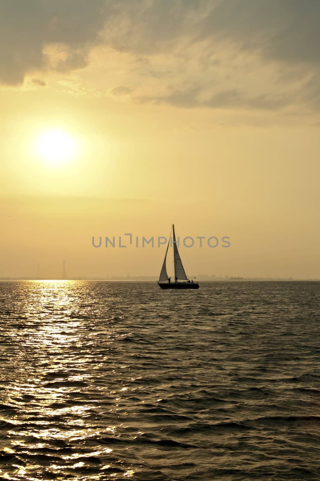 Sailing on the IJsselmeer at sunset in the Netherlands