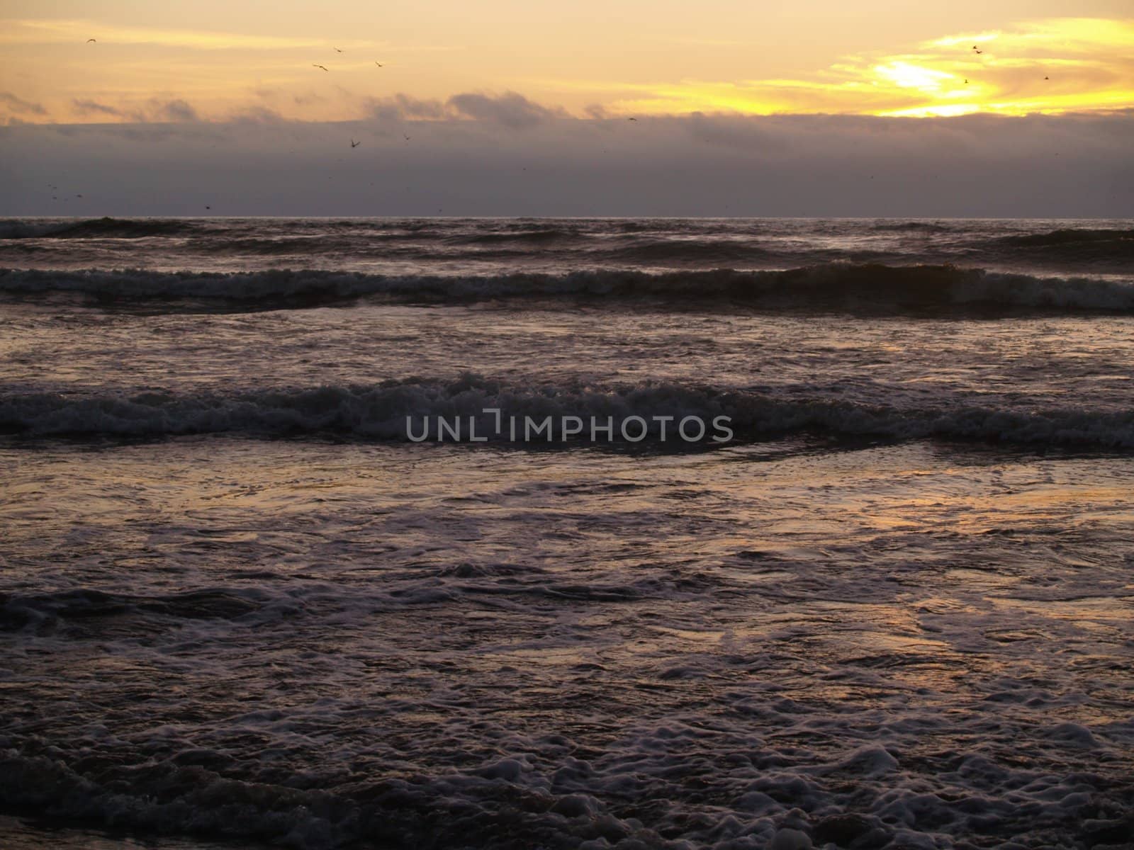 Beautiful Sunset Over the Ocean wth Waves in the Foreground by Frankljunior