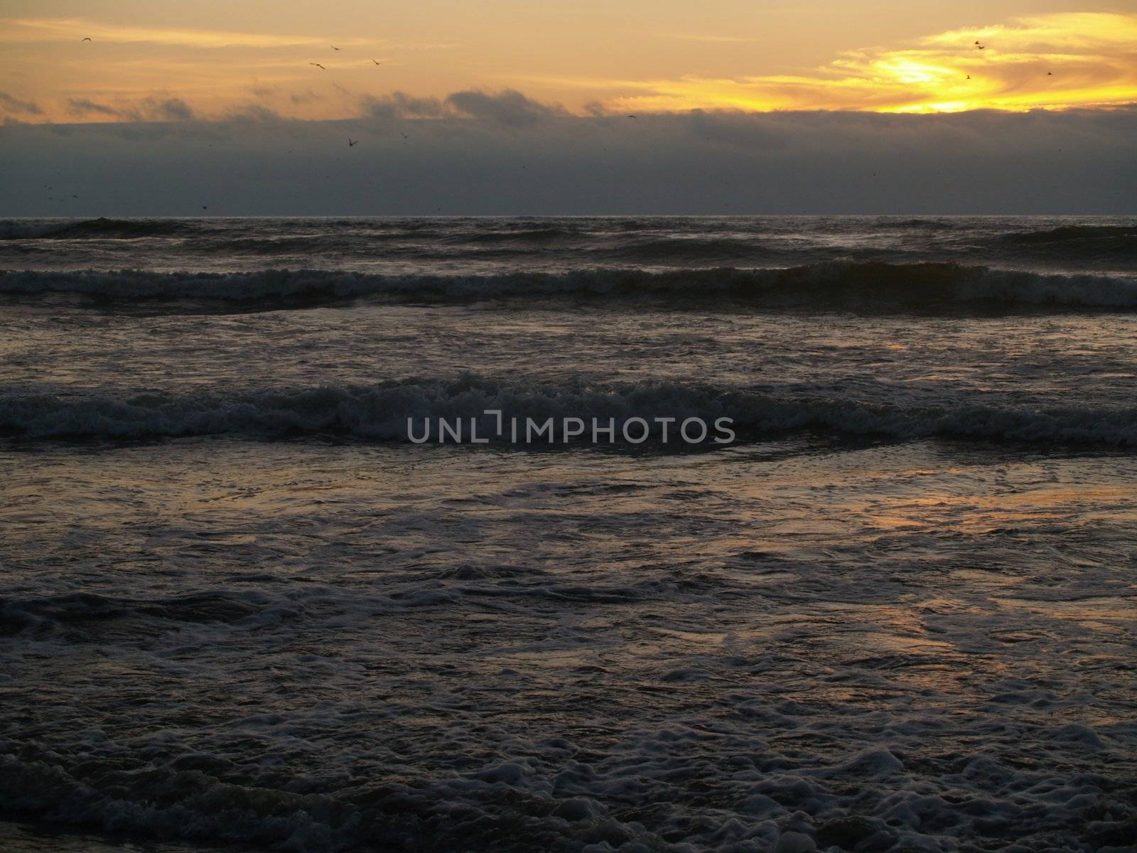 Beautiful Sunset Over the Ocean with Waves in the Foreground by Frankljunior