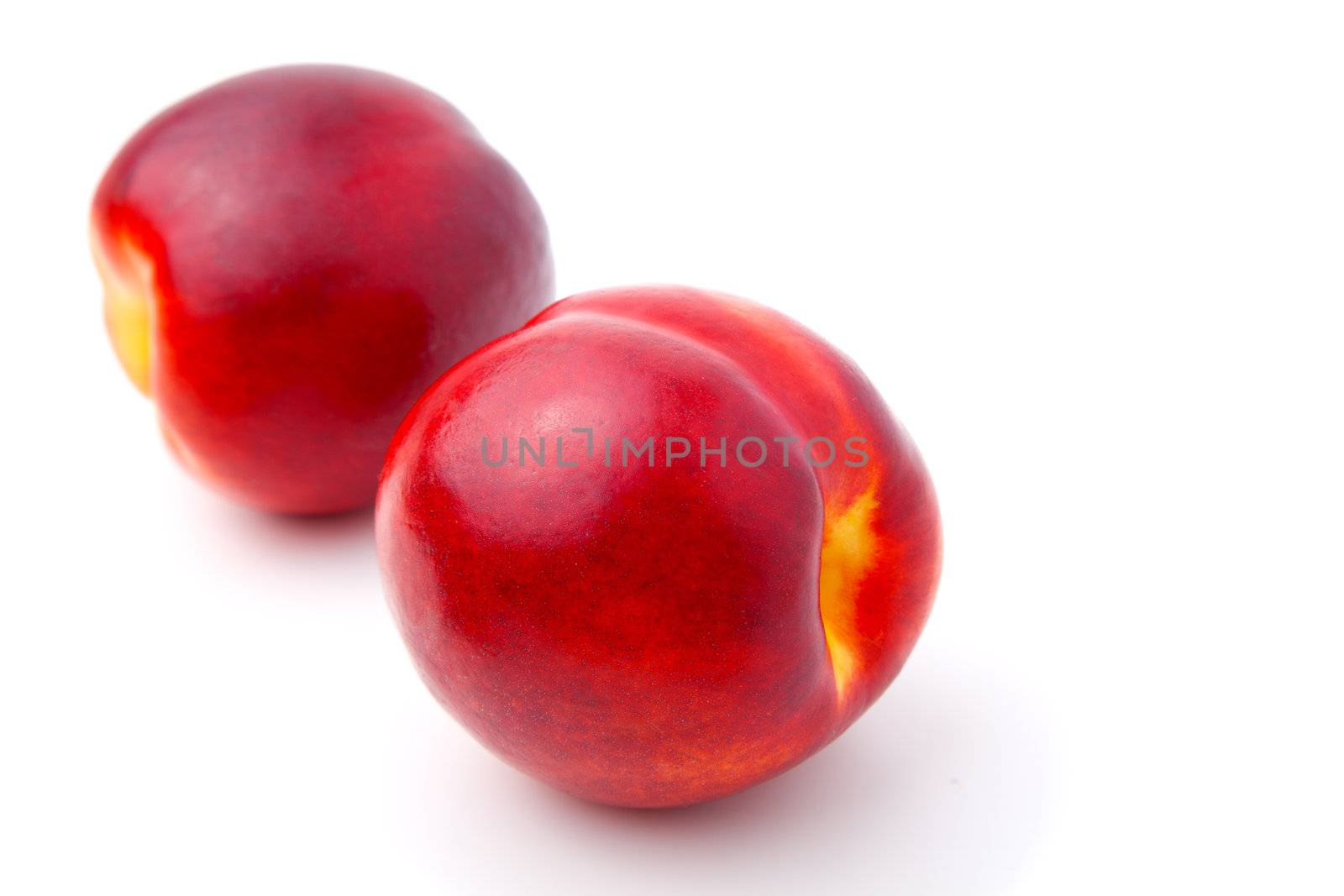 Ripe nectarine fruit isolated on white background
