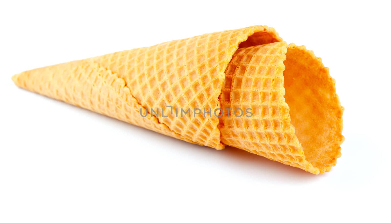 Empty sugar waffle cone for ice cream, on a white background