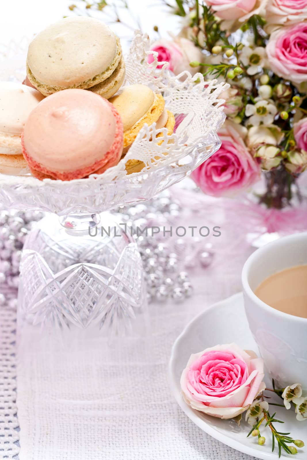 traditional delicious sweet dessert macarons and coffee on table