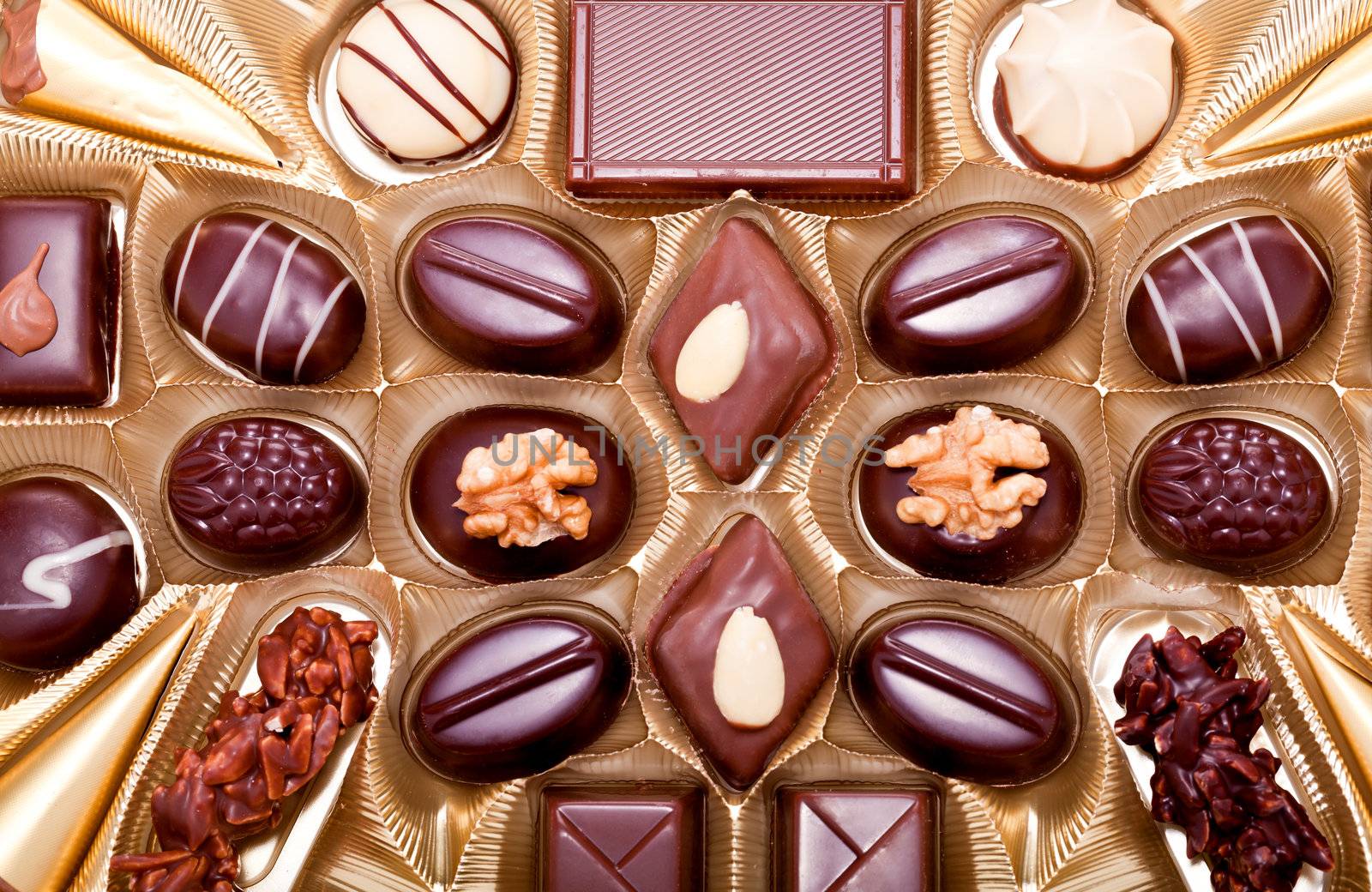 collection of different sweet chocolate pralines closeup background present sugar