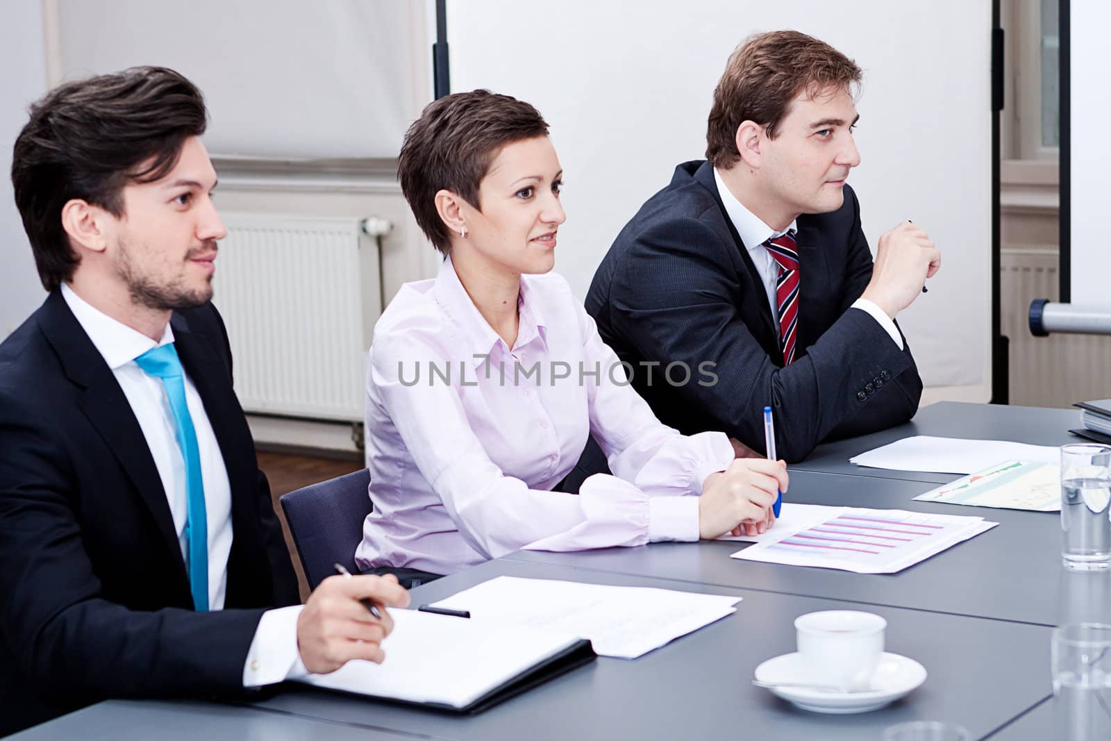 business team on table in office conference seminar presentation