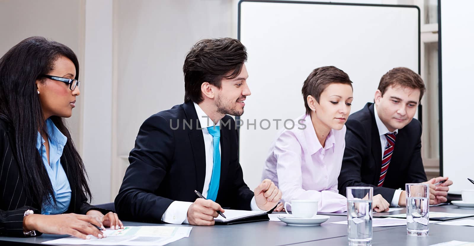 business team on table in office conference seminar presentation