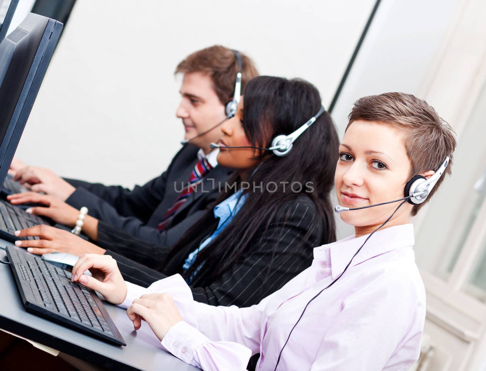 smiling callcenter agent with headset support by juniart