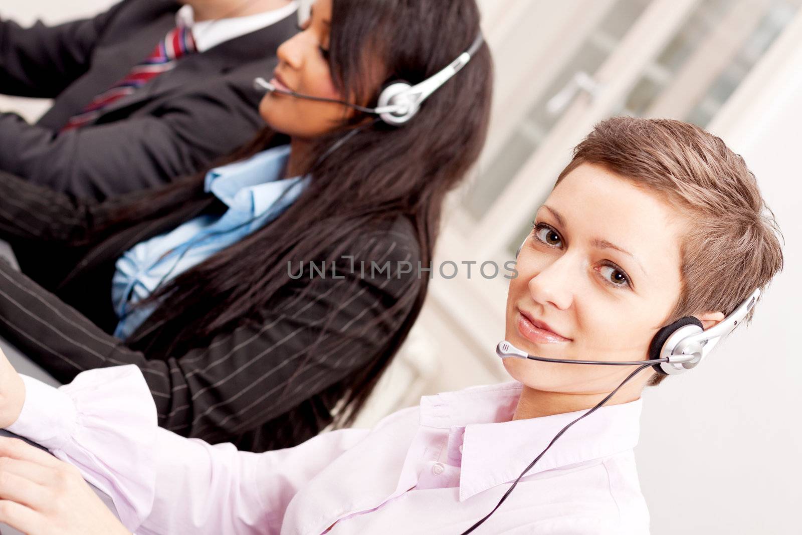 smiling callcenter agent with headset support hotline