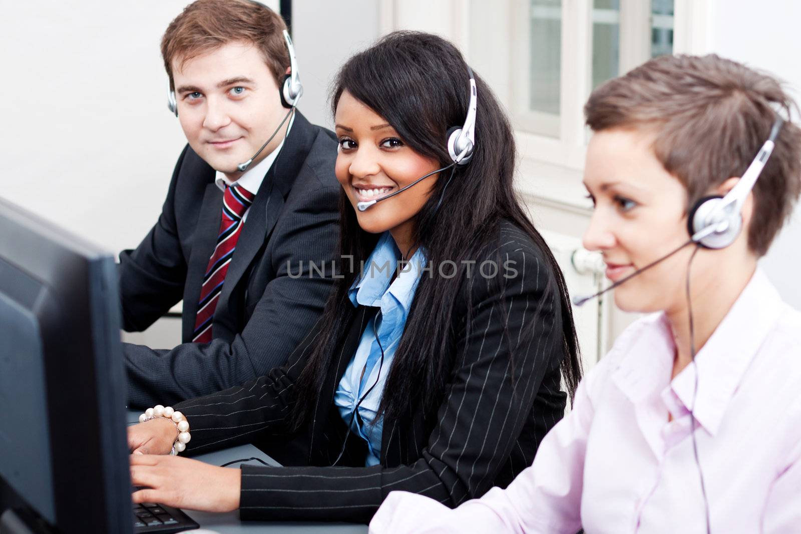 smiling callcenter agent with headset support by juniart