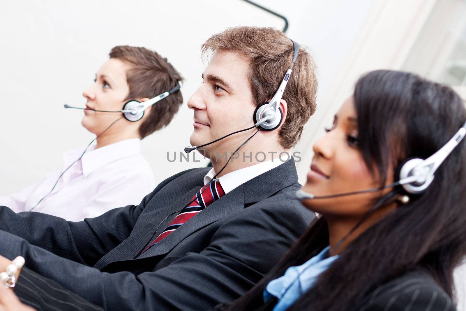 smiling callcenter agent with headset support by juniart