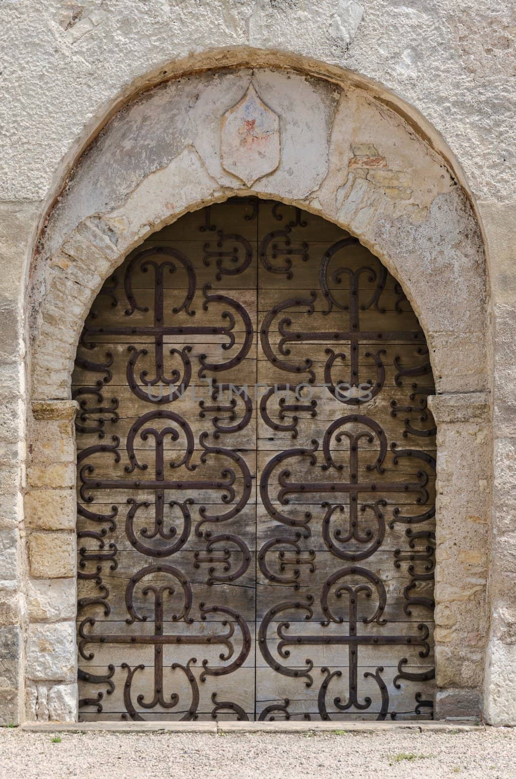Old portal of romanesque church in Chapaize, France.