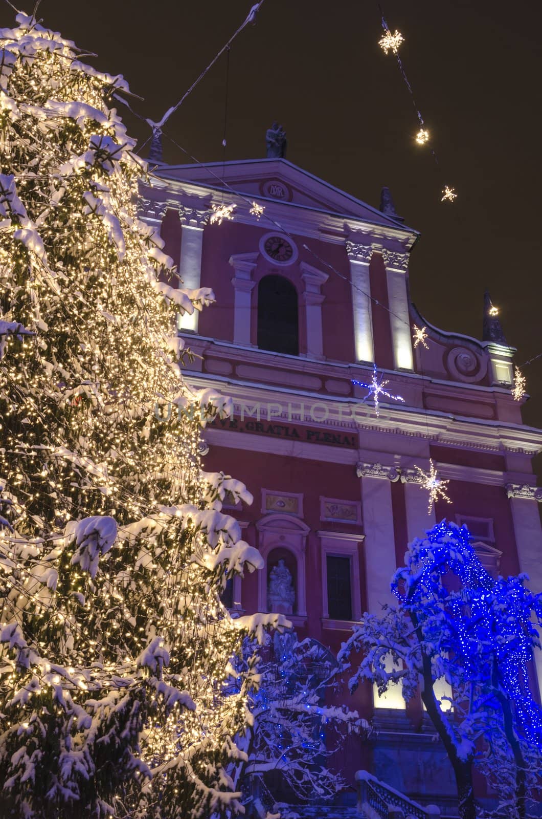 Christmas tree on Preseren square with church behind. Ljubljana, Slovenia, on December 8, 2012.