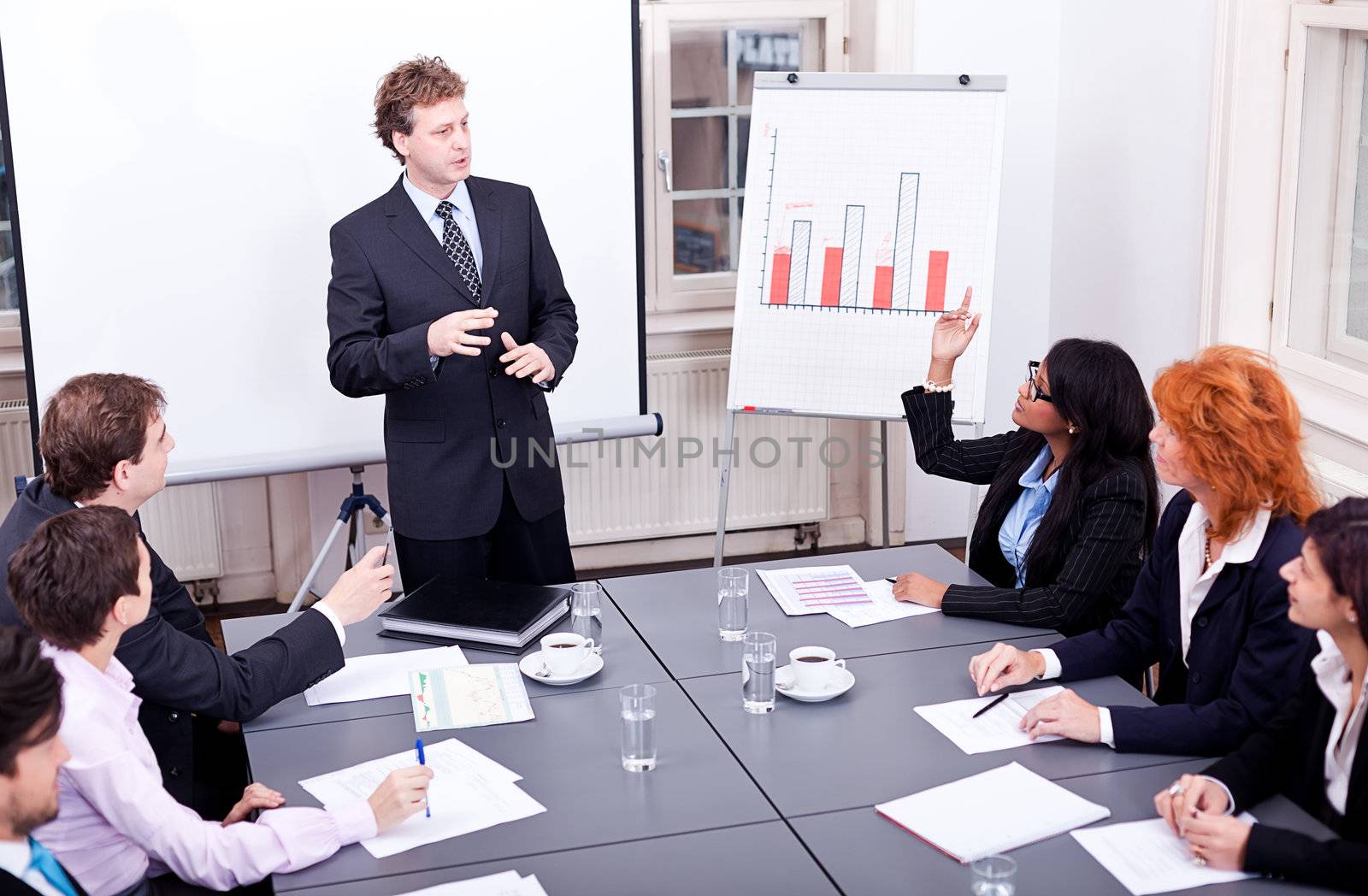 business team on table in office conference seminar presentation