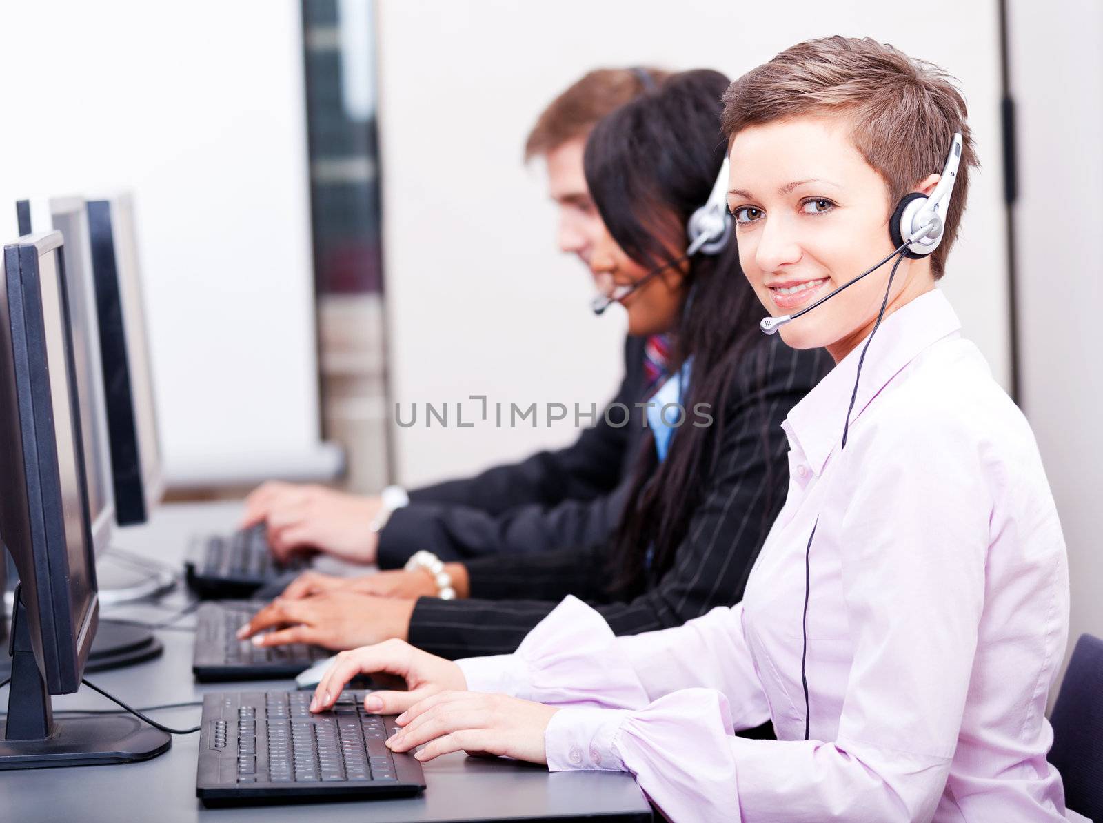 smiling callcenter agent with headset support by juniart