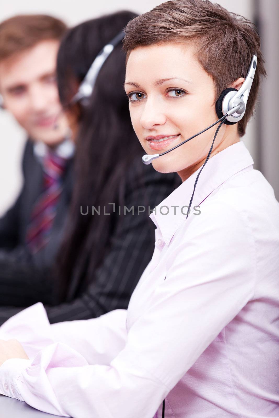 smiling callcenter agent with headset support by juniart