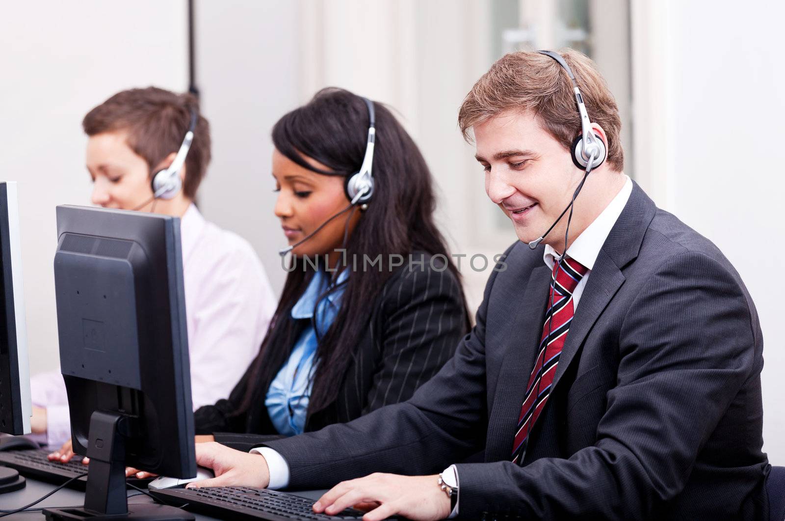 smiling callcenter agent with headset support by juniart