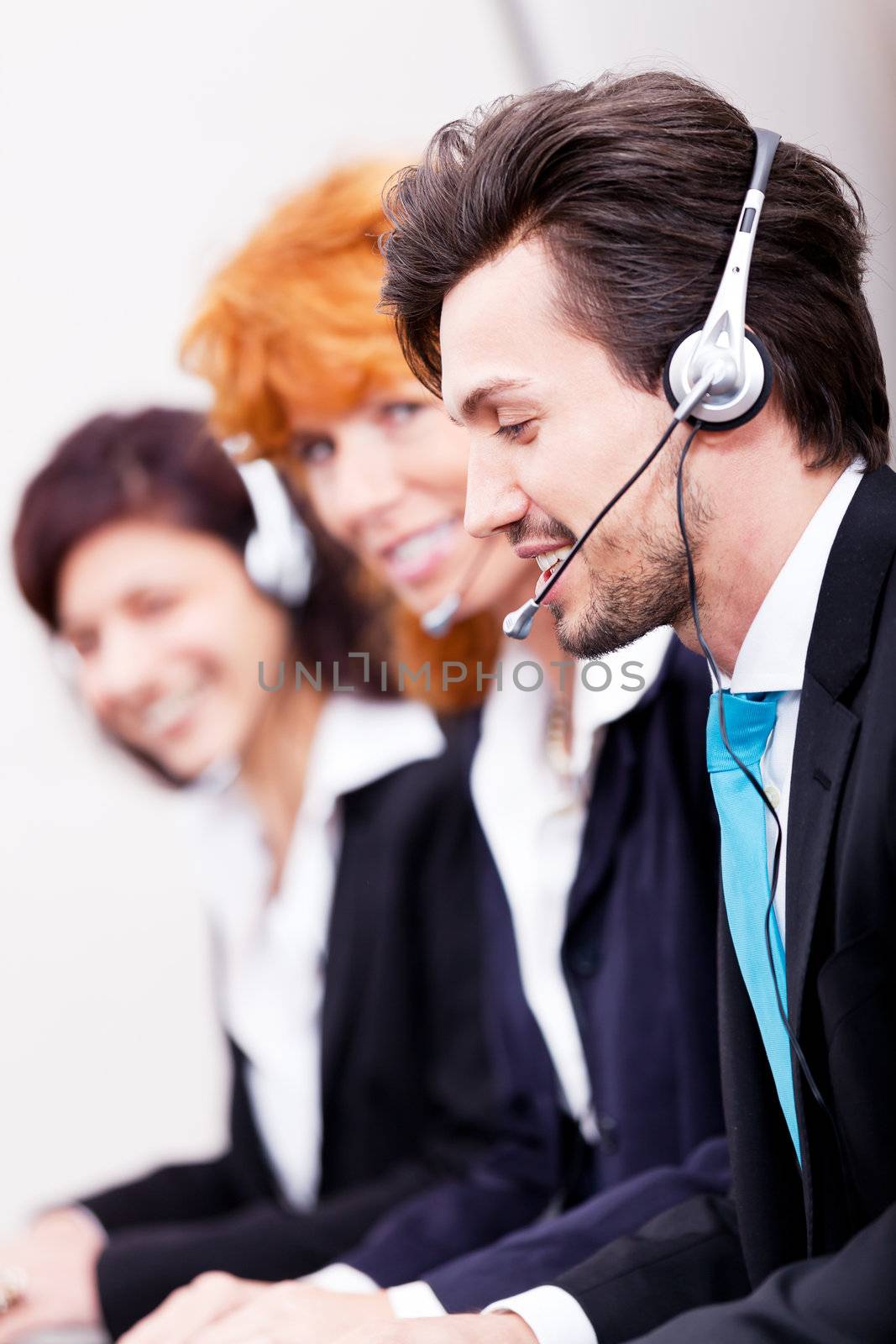 smiling callcenter agent with headset support by juniart