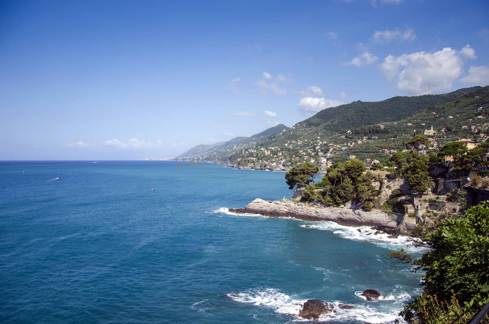 View over Ligurian coastline dissapearing into horizon, Camogli, Italy.