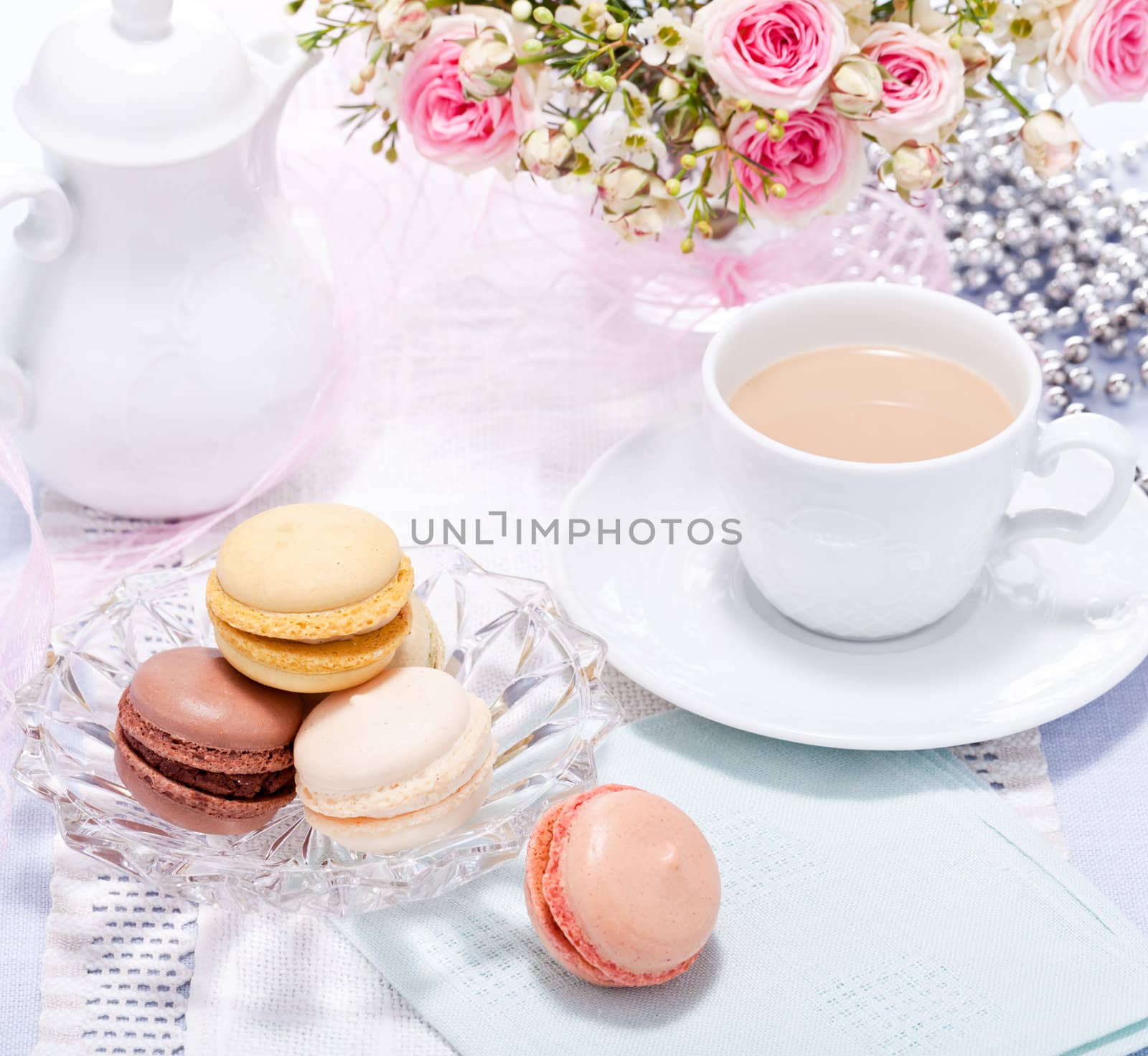 traditional delicious sweet dessert macarons and coffee on table
