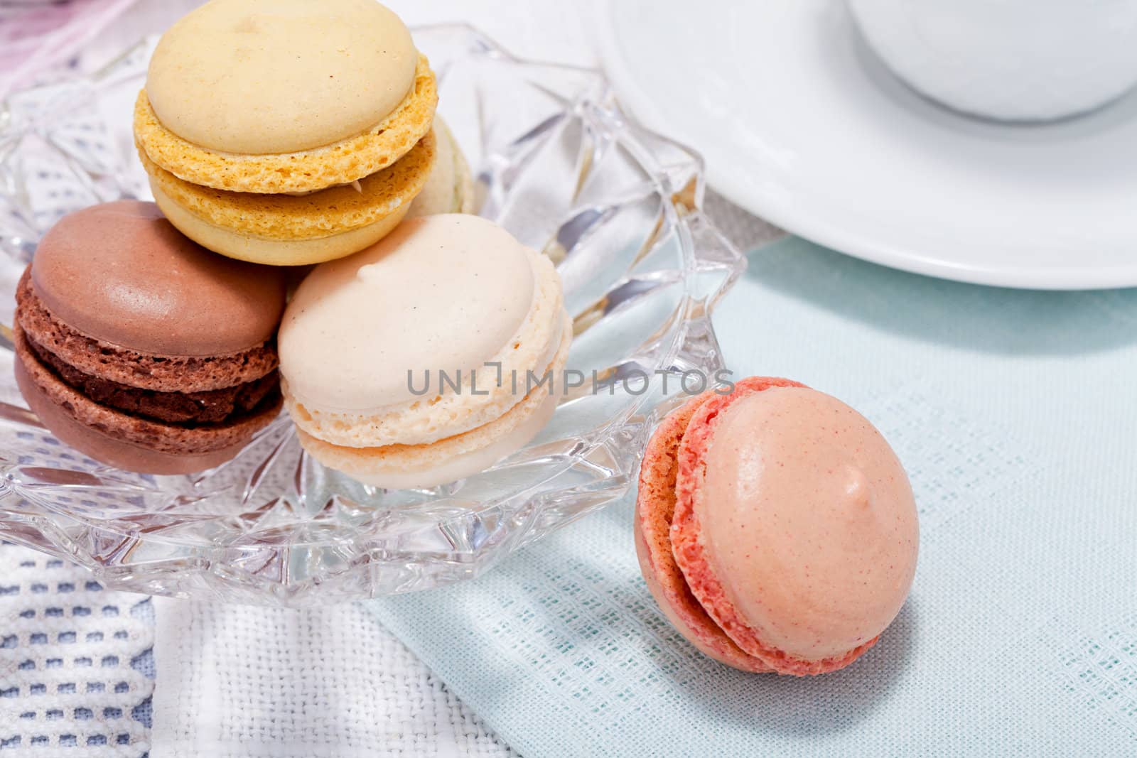 traditional delicious sweet dessert macarons and coffee on table