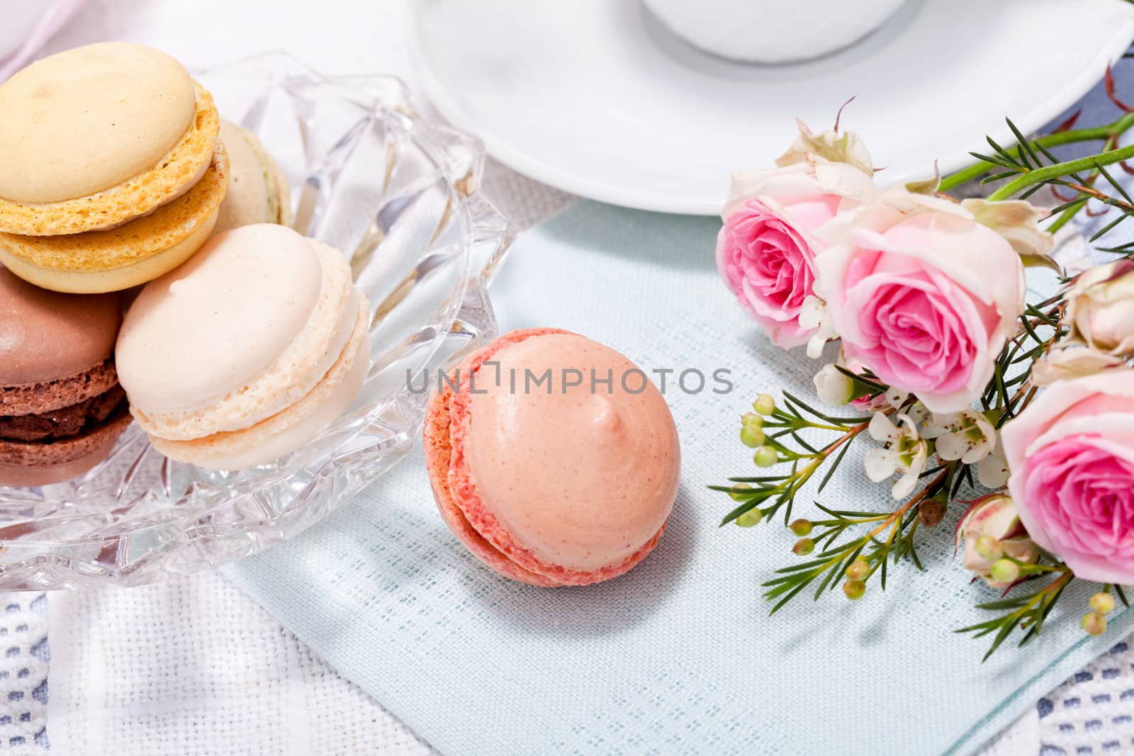 traditional delicious sweet dessert macarons and coffee on table