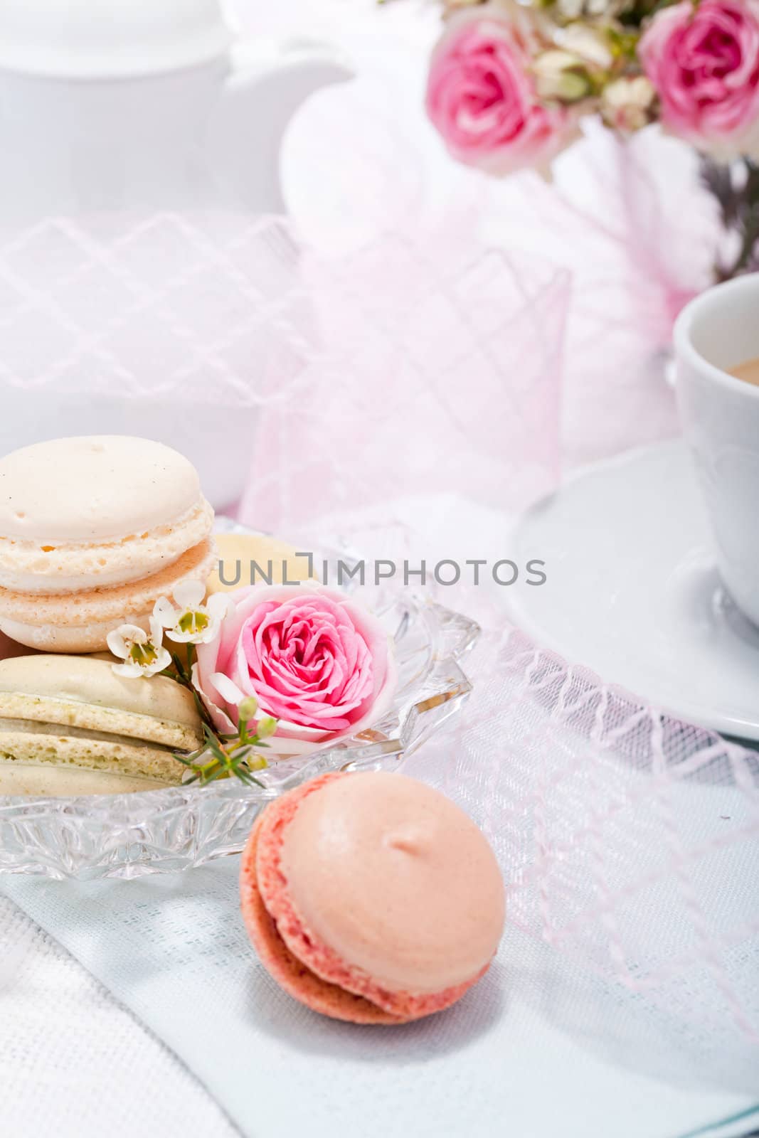 traditional delicious sweet dessert macarons and coffee on table