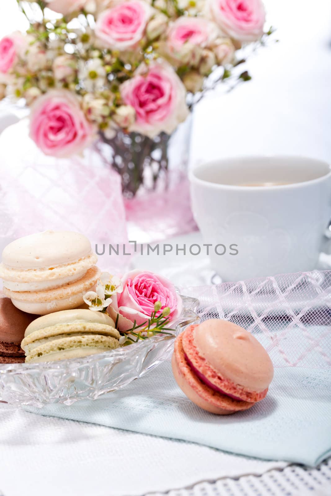 traditional delicious sweet dessert macarons and coffee on table