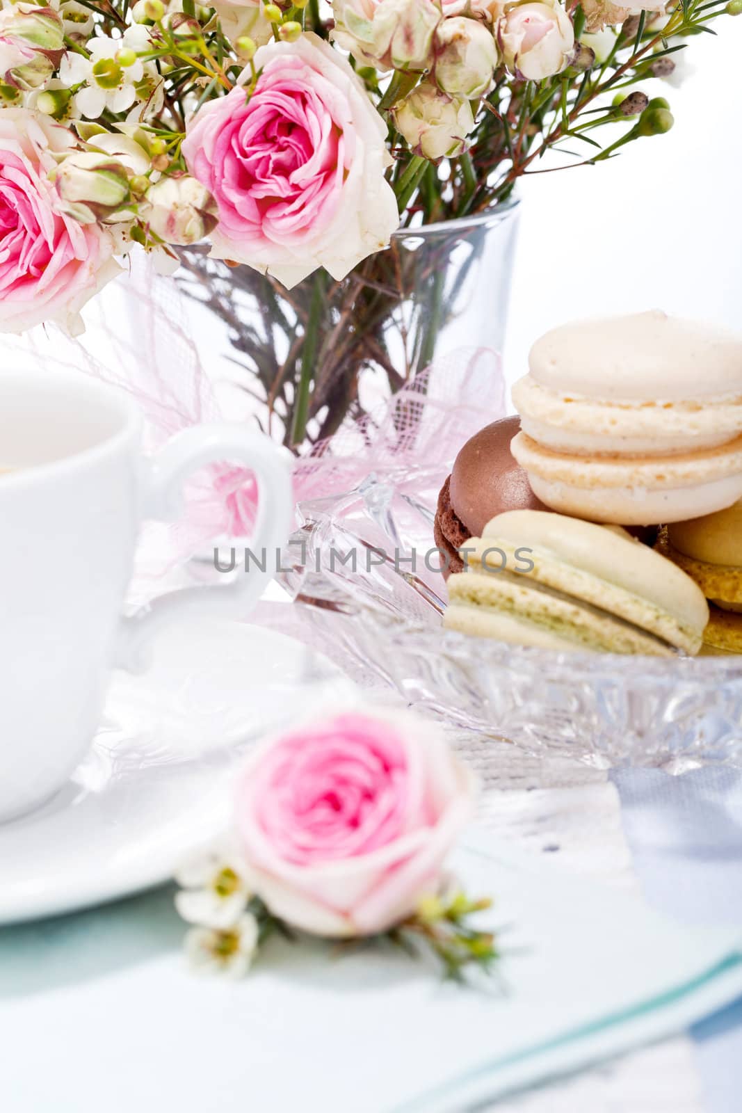 traditional delicious sweet dessert macarons and coffee on table