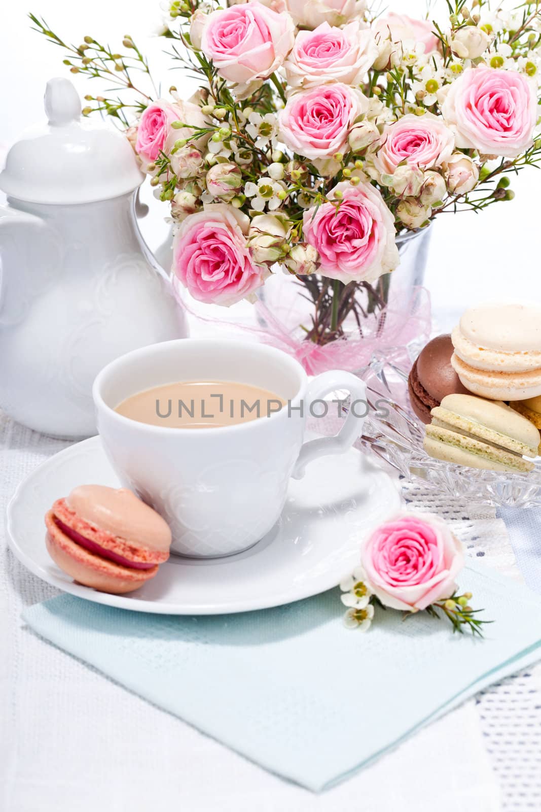 traditional delicious sweet dessert macarons and coffee on table