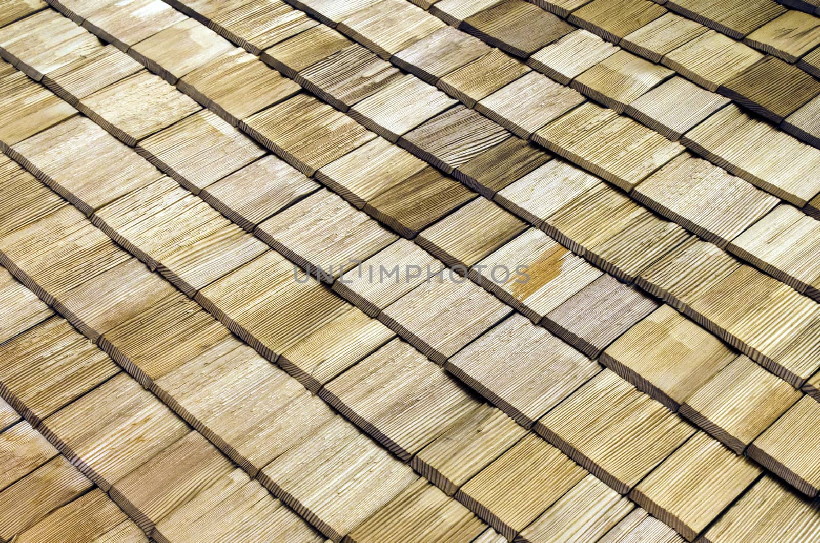 Detail of wooden roof shingles arangement.