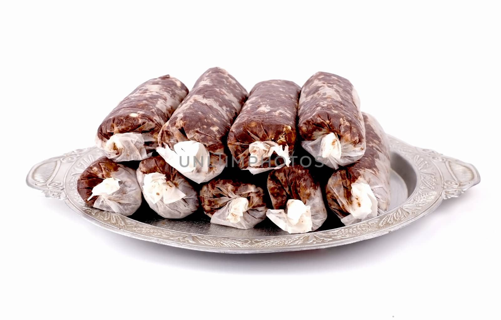 Homemade cake "sausage" in tracing the aluminum tray on a white background