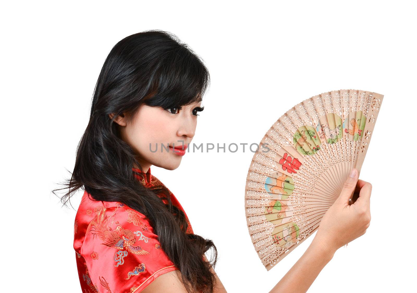 pretty women with Chinese traditional dress Cheongsam and hole Chinese Fan on white background