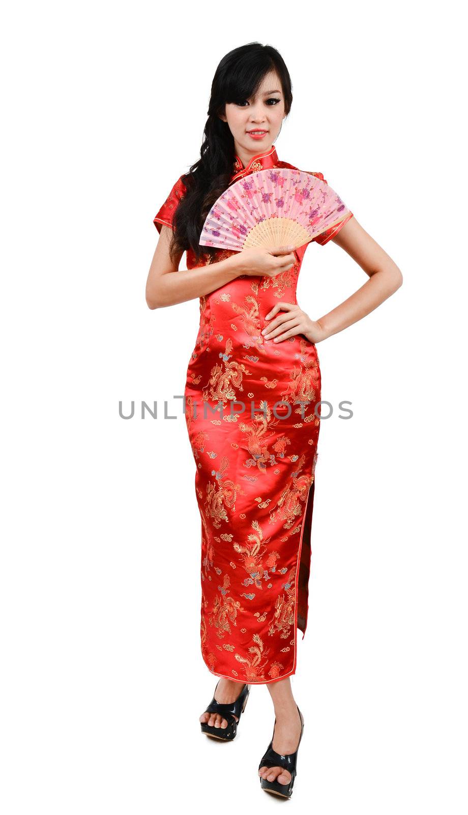 pretty women with Chinese traditional dress Cheongsam and hole Chinese Fan on white background