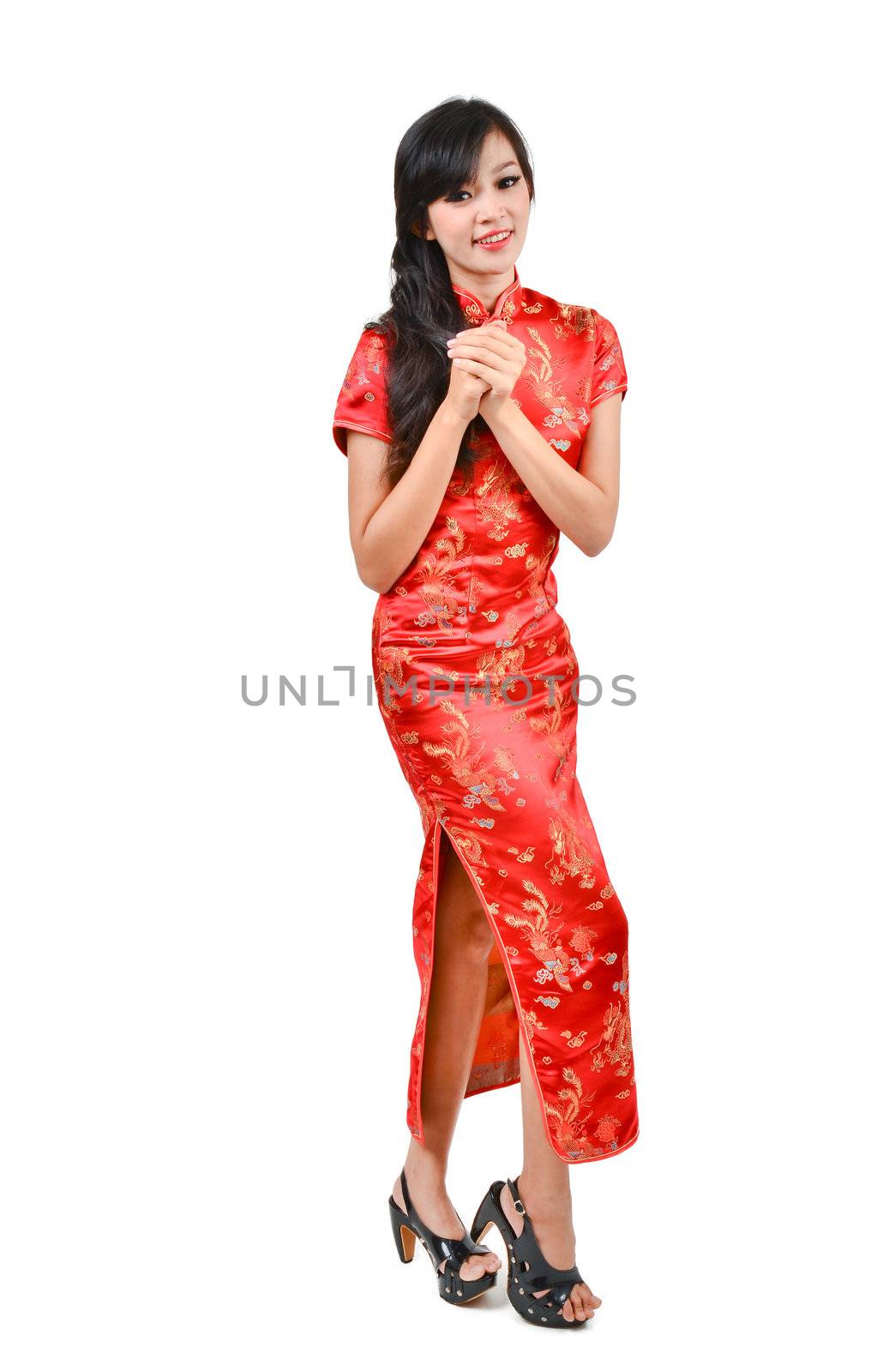 pretty girl with cheongsam wishing you a happy Chinese new year  by anankkml