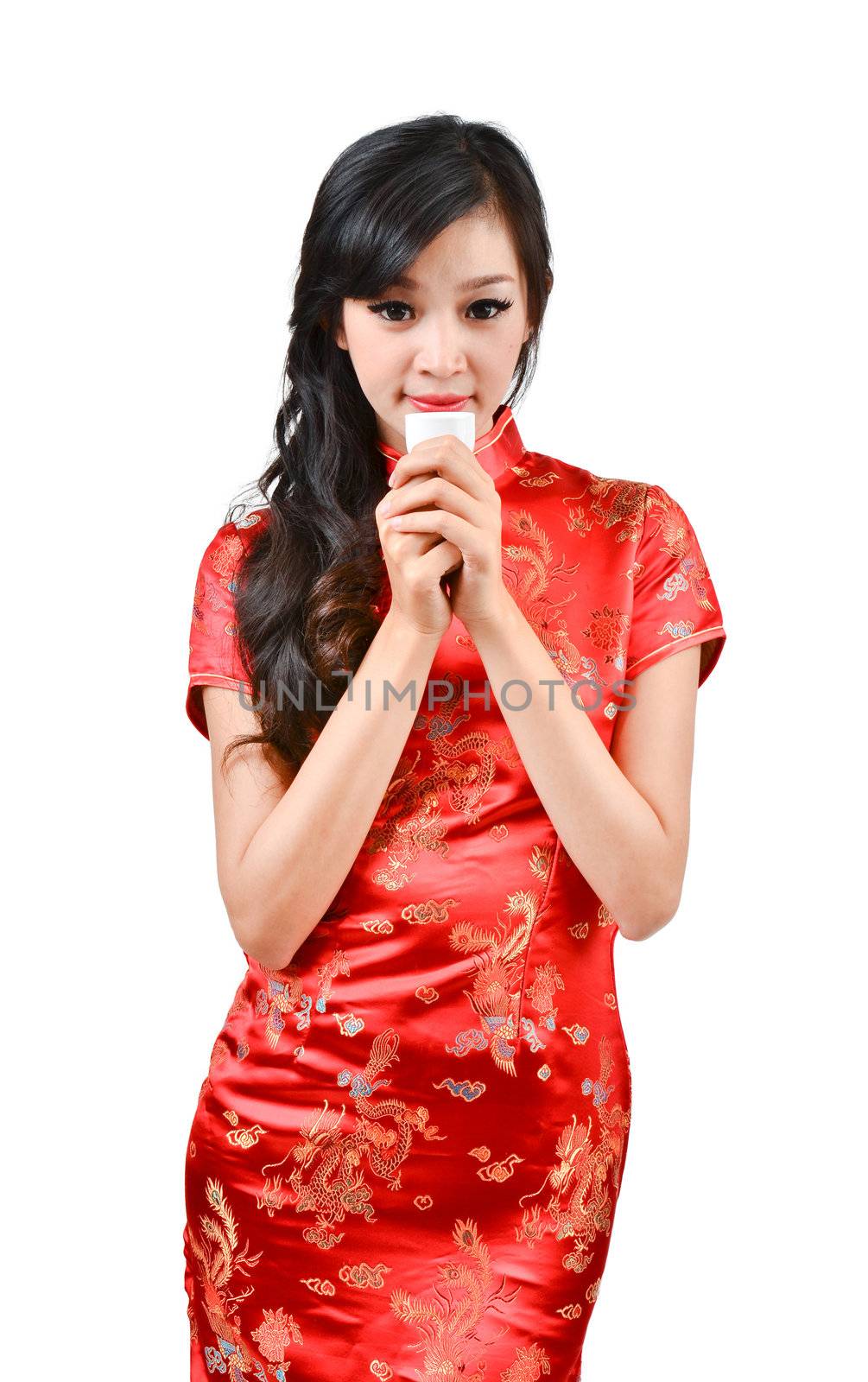 pretty women with Chinese traditional dress Cheongsam and drinking tea on white background