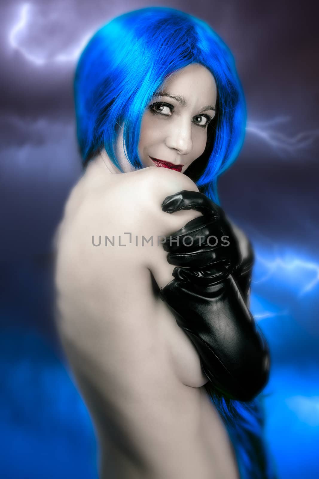 vogue style portrait of beautiful delicate woman with blue hair over electric storm