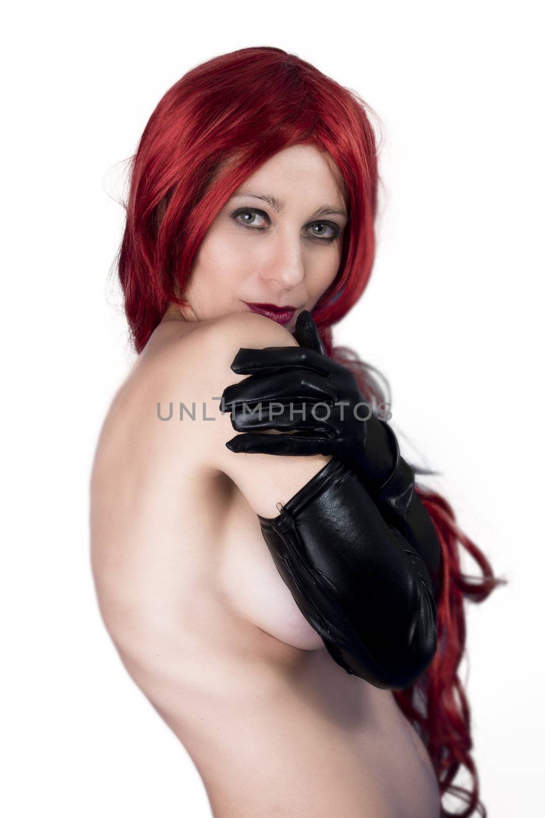 Fetish red hair model posing in black latex outfit