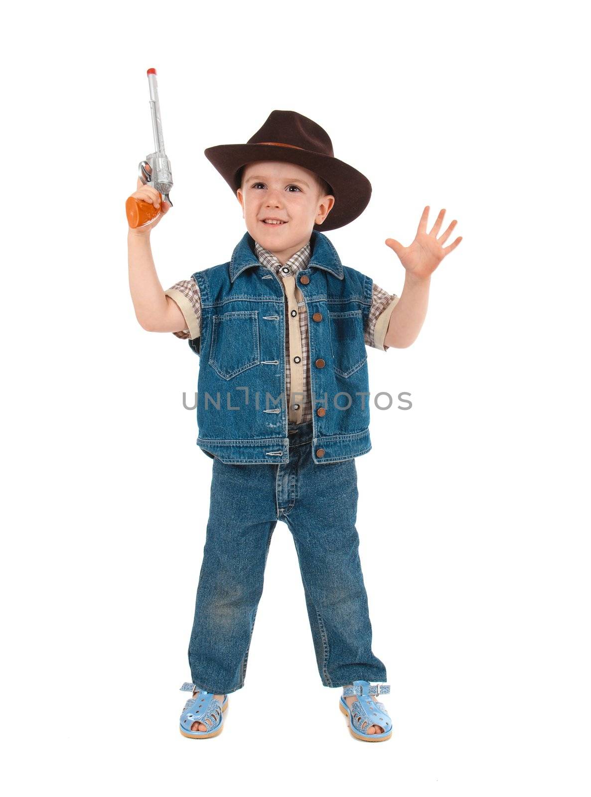 little boy wearing a cowboy hat a over white background