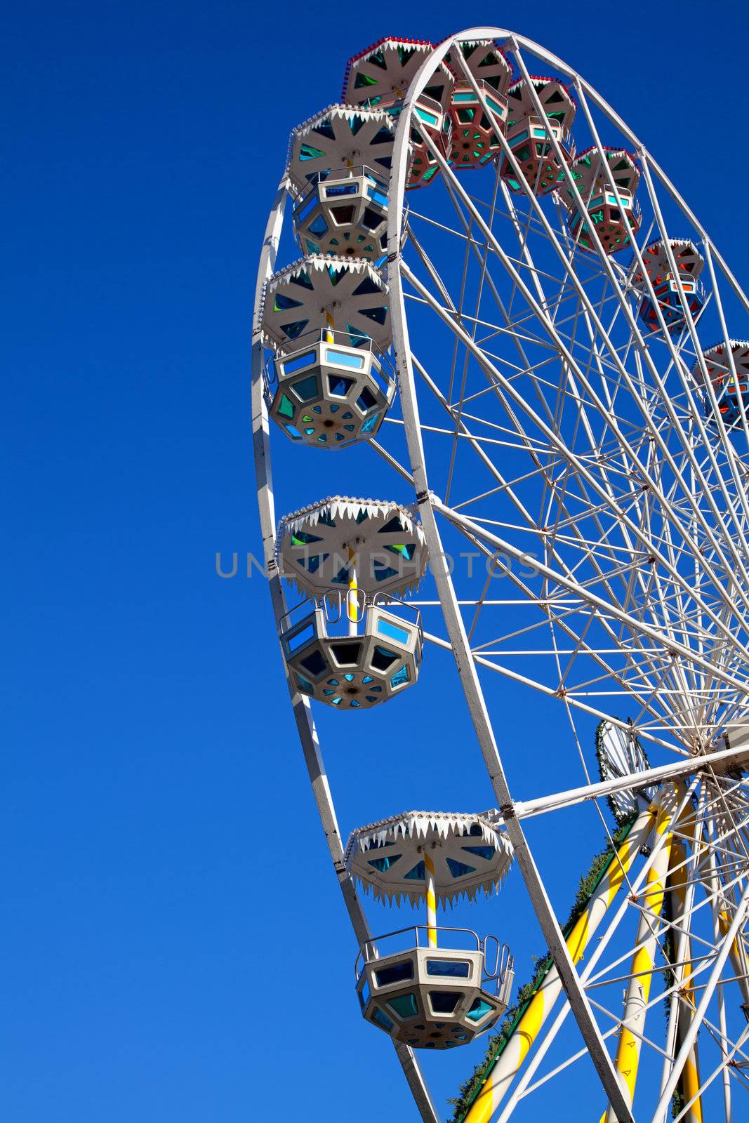 Attraction is the wheel of review on background blue sky by motorolka
