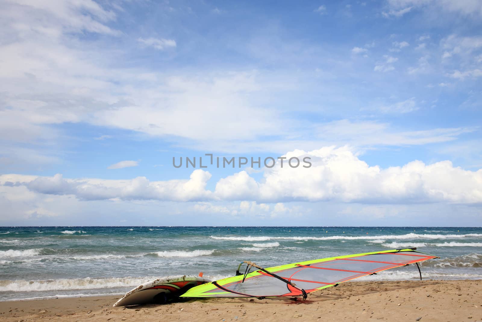 windsurf left on a sandy beach