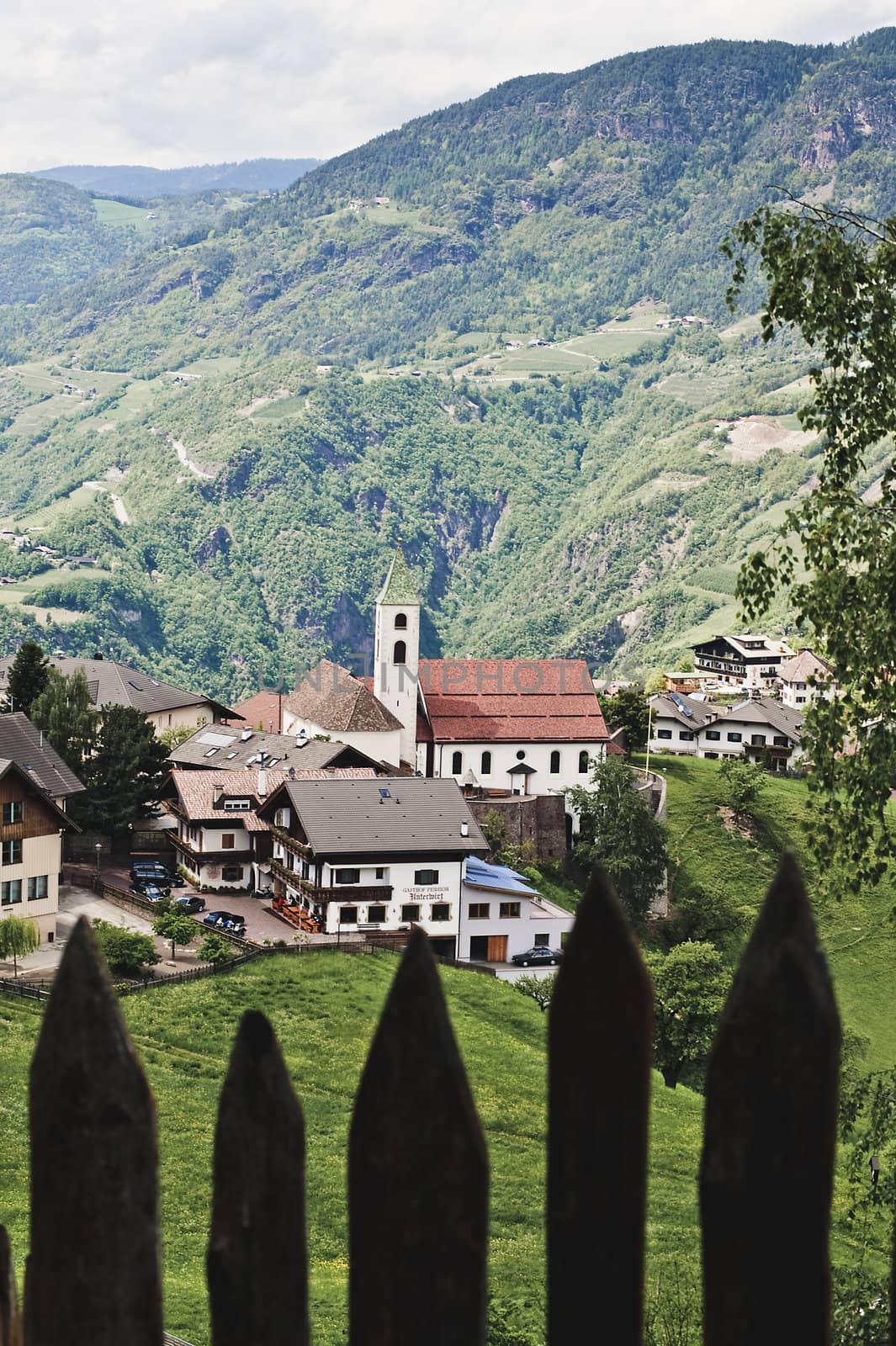 Village behind a wooden Fence, taken in South Tyrol