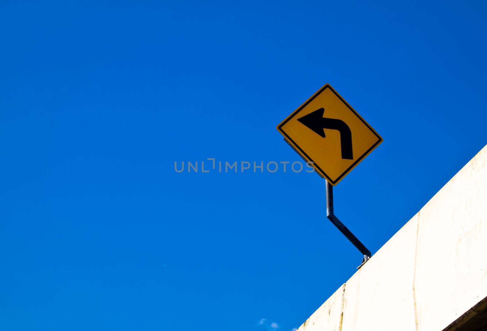 Turn left sign with blue sky2