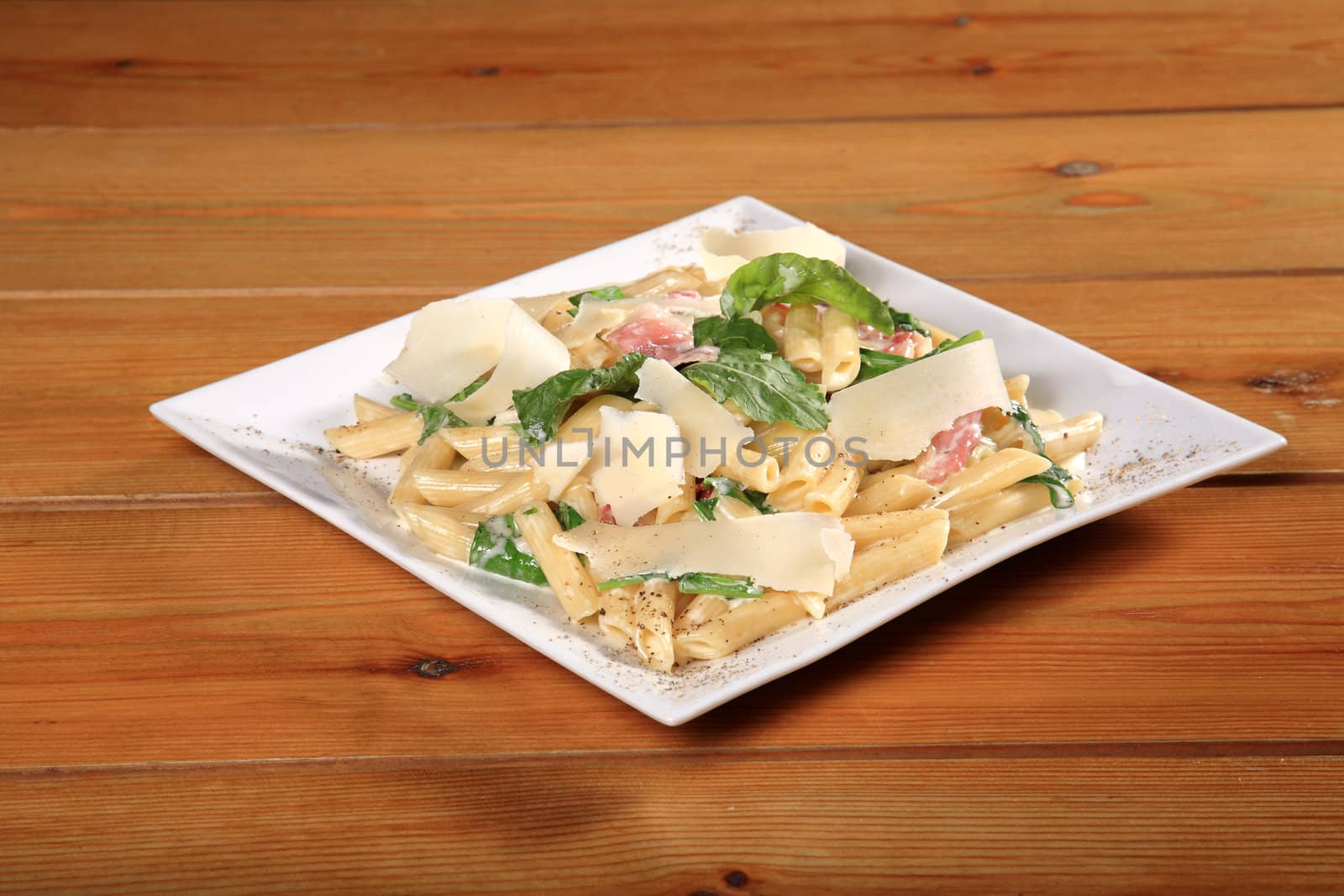 fresh pasta rigatoni with bacon, mint and parmezano cheese