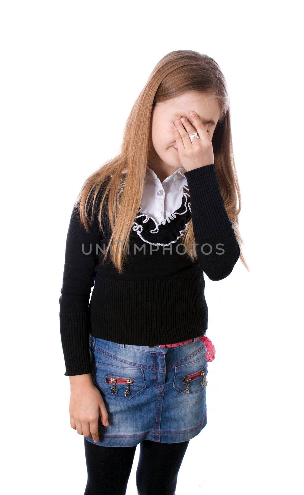 Side portrait of a beautiful girl crying and covering her face isolated on white