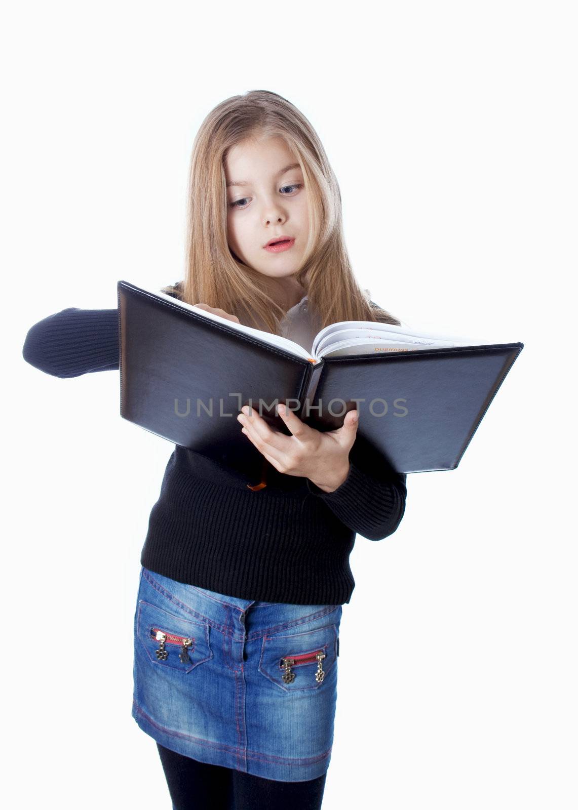 school girl standing with blank book in hands isolated on white