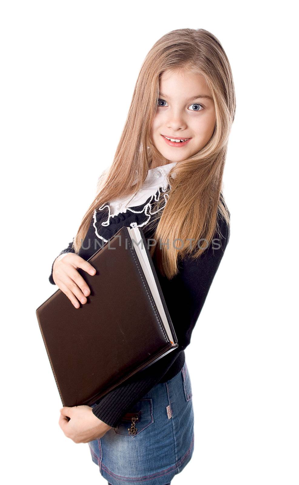 Smiling school girl standing with blank book in hands, isolated on white