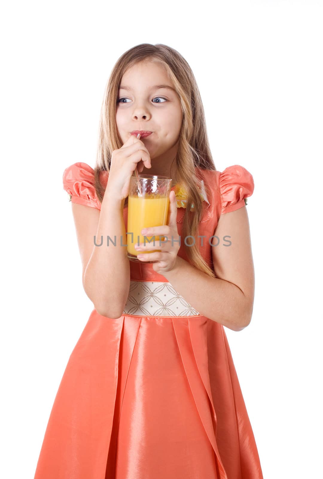 Portrait of happy little girl drinking orange juice