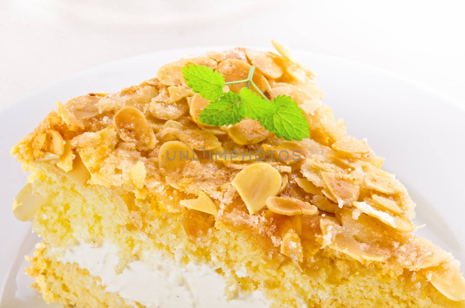 flat cake with an almond and sugar coating and a custard or cream filling by Darius.Dzinnik