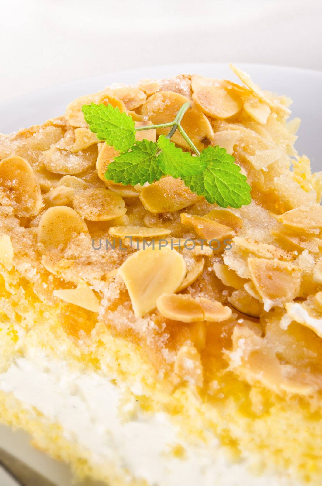 flat cake with an almond and sugar coating and a custard or cream filling by Darius.Dzinnik