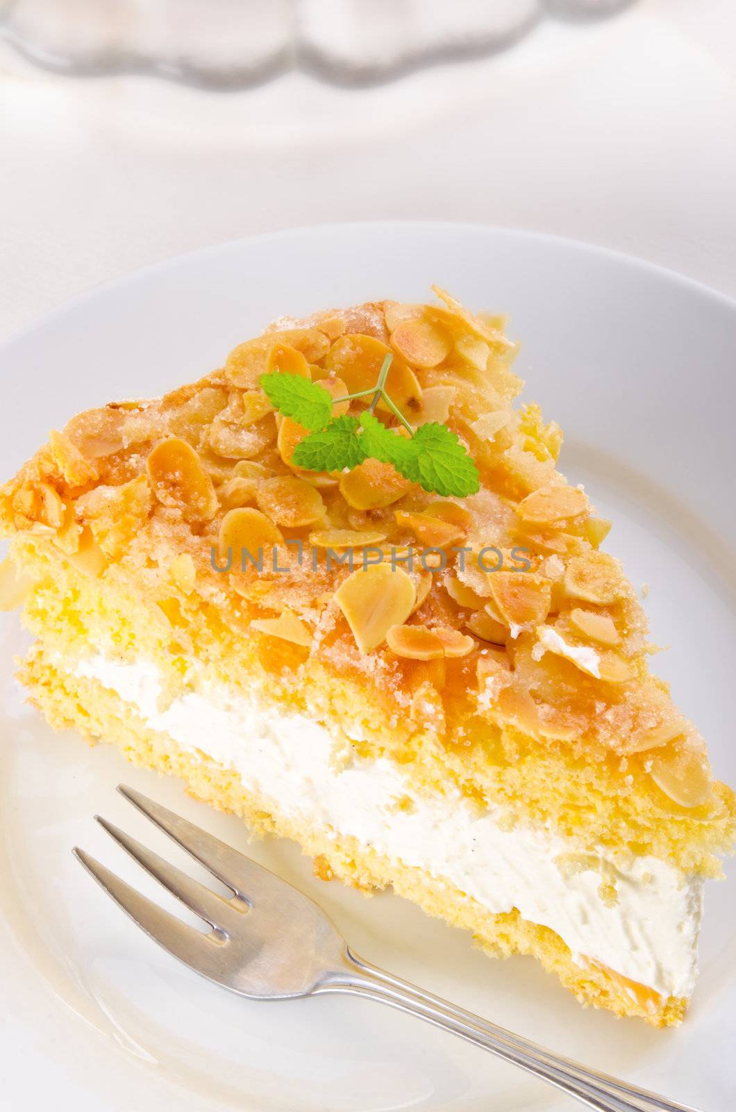 flat cake with an almond and sugar coating and a custard or cream filling